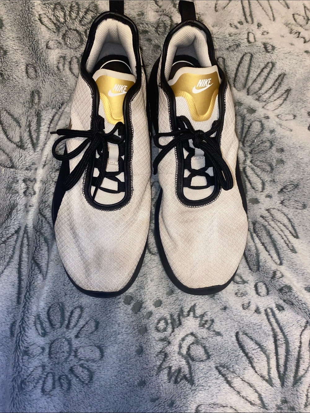 Nike Air Men’s White and Black Sneakers with Gold Tongue Accent